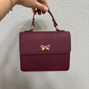 Elegant Burgundy Handbag with Gold Accent